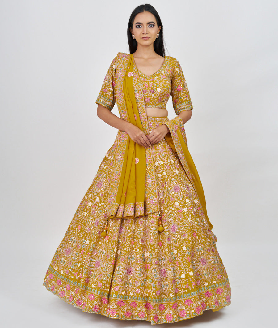 Mustrad Multi Color Thread Embroidery With Sequins And Pearl And Jarkan Stone Work  Lehenga