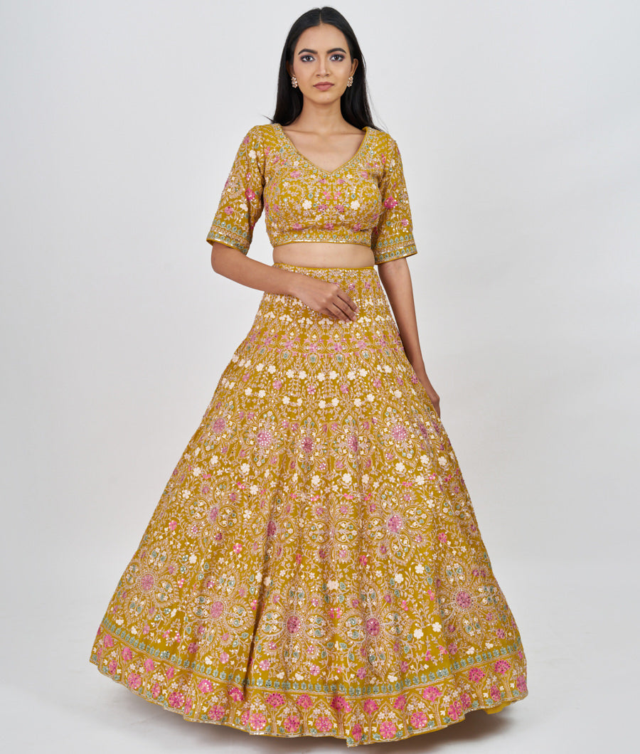 Mustrad Multi Color Thread Embroidery With Sequins And Pearl And Jarkan Stone Work  Lehenga